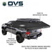 Image of an OVS XD Nomadic 270 LTE awning deployed from a pickup truck, black ripstop polycotton fabric with 5000 PU waterproof rating, shown freestanding in angled rear and side view on a white background.