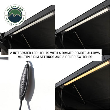 Image of the Nomadic Awning showing its two integrated LED lights with a dimmer remote, featuring white and yellow color options on the black fabric. The image includes a close-up of the remote control