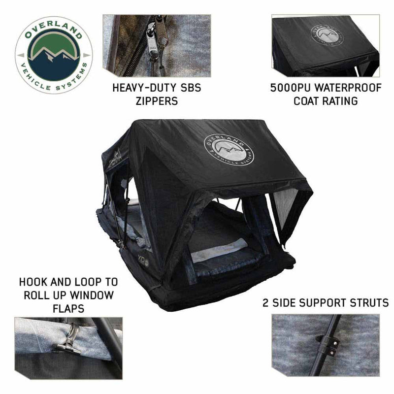 Image showing a black Overland Vehicle Systems Sherpa Roof Top Tent, fully deployed, highlighting its heavy-duty SBS zippers, 5000PU waterproof coat rating, hook and loop fasteners for rolling up window flaps, and two side support struts. The tent is angled on a white background, with close-up details of each feature