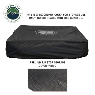 Image of a black premium rip stop storage cover for a rooftop tent, featuring a subtle logo in the center and a close-up swatch of the fabric below, with a warning that it's for storage use only and not for travel. The "Overland Vehicle Systems" logo is in the top left corner, all on a white background