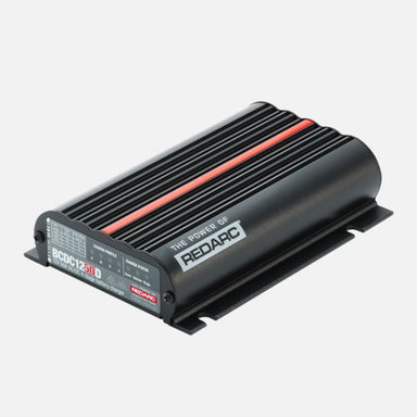 Image of a black REDARC BCDC Classic 50A Battery Charger with a red stripe running along the top, shown at a slight angle on a gray background. The product label is visible on the front face