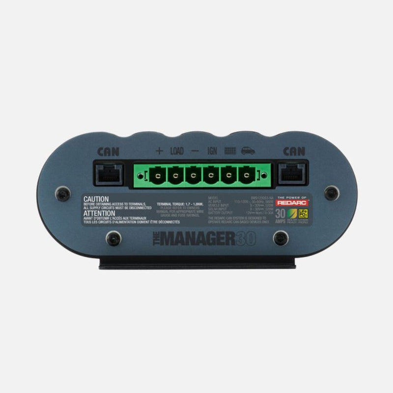 Image of Redarc Manager30 battery management system front panel, showing labeled CAN ports, green terminal connections for power and load, and product branding, close-up view on white background