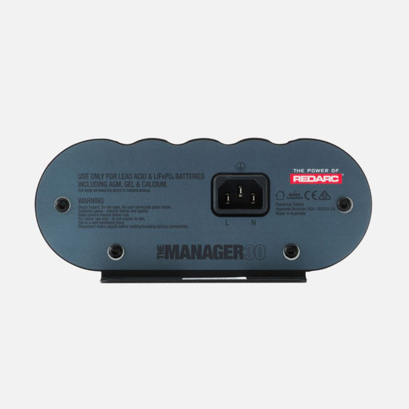Image of the REDARC Manager30 battery management system, rear view, showing the AC input, product warnings, and compatibility for Lead Acid & LiFePO4 batteries including AGM, Gel, & Calcium types, on a white background