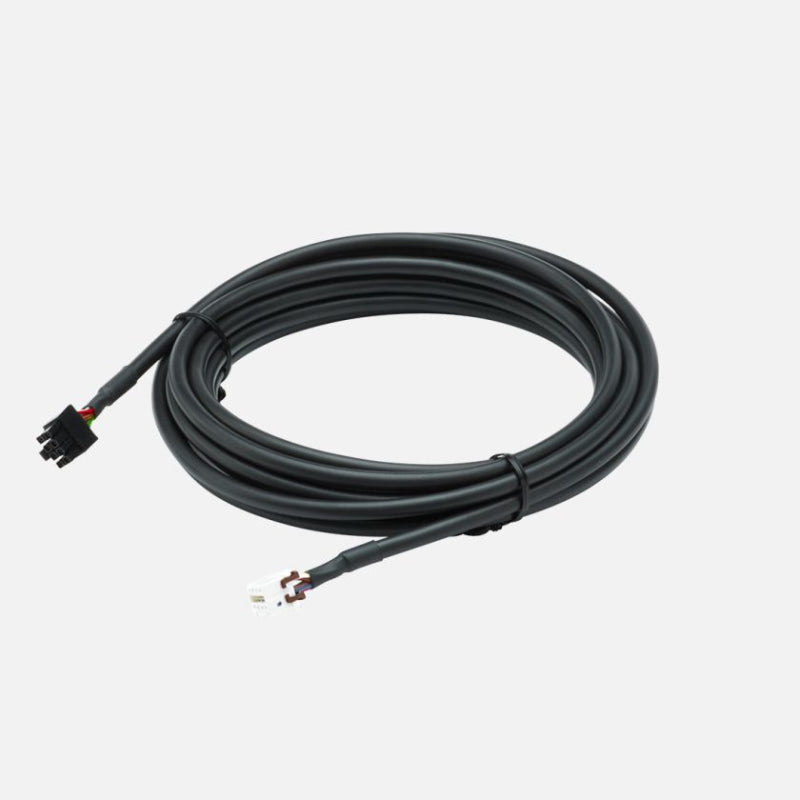 Image of remote head wiring kit with coiled black extension cable and multi-pin connectors, angled top view on white background.