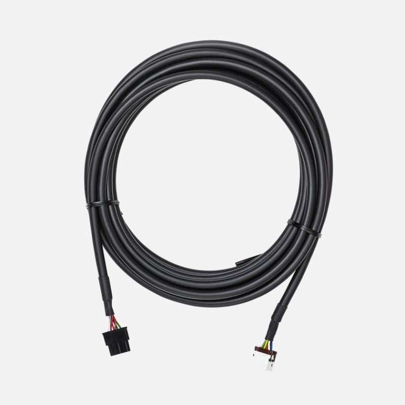 Image of extended remote head wiring harness with long coiled black cable and multi-pin plug connectors, angled top view on white background.
