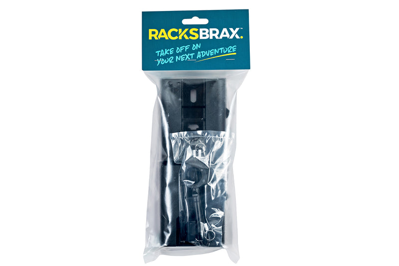 Image of Rack 'N' Trax awning brackets, keys, and security cables packaged in a clear plastic bag with a blue and yellow "RACKS BRAX Take off on your next adventure" header, centered on a white background.