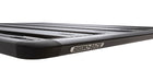 Image of Rhino-Rack roof rack, black aluminum frame with slatted design and rounded corners, close-up view with Rhino-Rack logo on white background