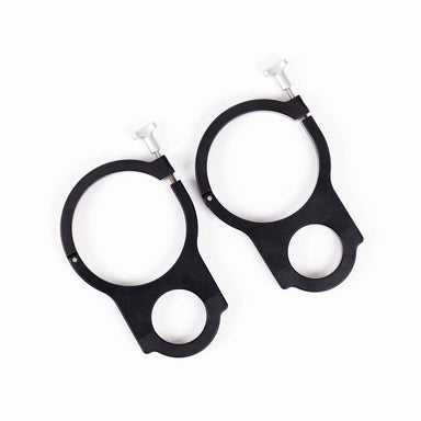Two black RollPaX mounting rings with silver screws, lying on a white background.
