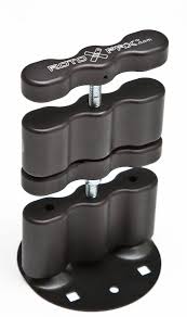 Image of black RotopaX pack mount extension kit with stacked mounting blocks, threaded bolt and round base plate, angled front view on white background.