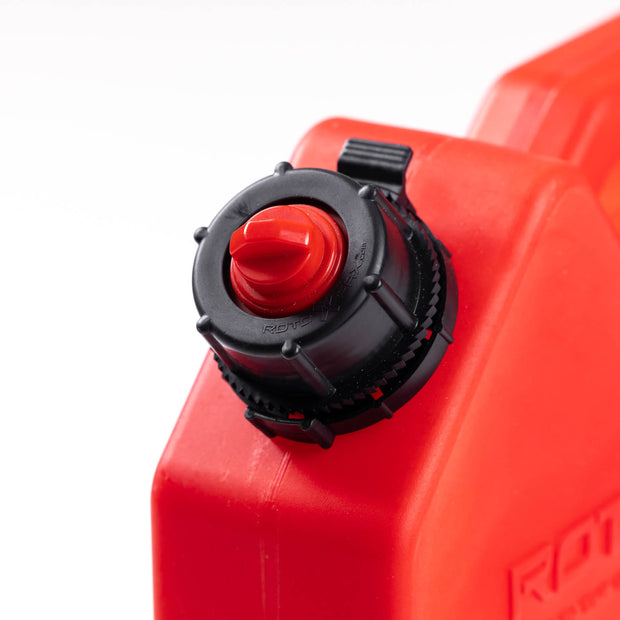 Image of RotopaX 1 Gallon Gasoline fuel container spout cap, close-up view of black threaded cap with red vent on red can, angled detail shot on white background.