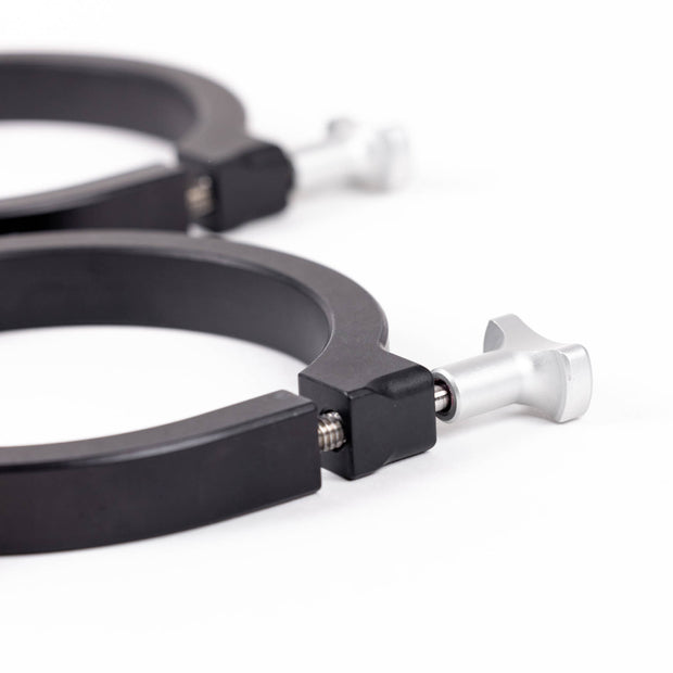 Image of two black powder-coated aluminum mounting clamps, each with a silver T-handle bolt for secure attachment.