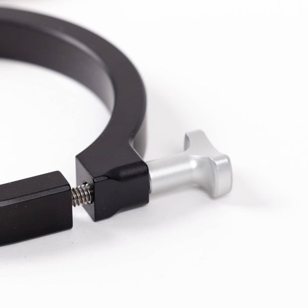Close-up image of a black powder-coated aluminum mounting clamp, showcasing the silver T-handle bolt and spring mechanism against a white background.