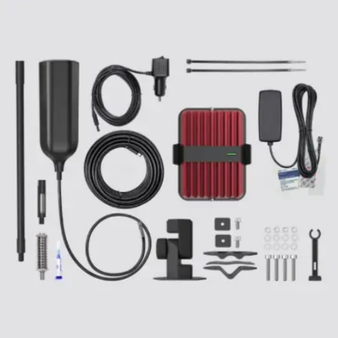 Image of all the components of a weBoost cellular signal booster kit laid out on a white background, including the black antenna, a red booster box, various cables, mounting brackets, bolts, nuts, and other hardware