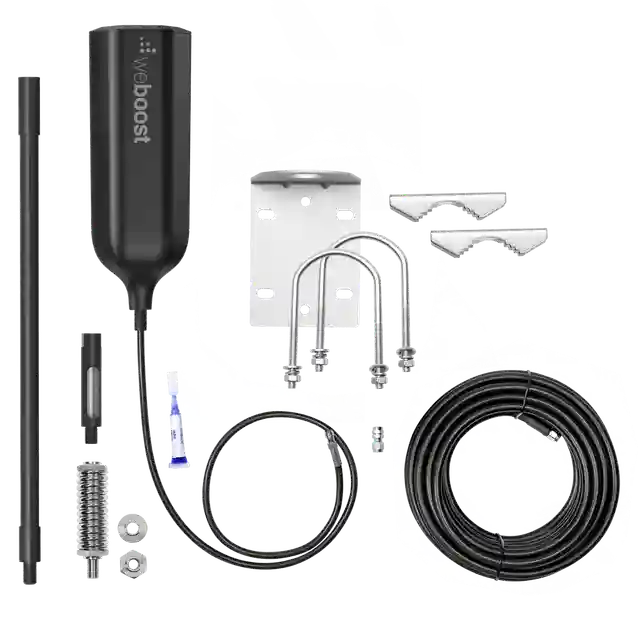 Image of a WeBoost Drive Reach RV cell signal booster kit, featuring a black booster unit, a black antenna pole, coiled black cables, and various mounting brackets and hardware, laid out on a white background.