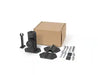 Image of a WeBoost antenna mounting kit, featuring a brown cardboard box, a black adjustable mount, two black flat mounting plates, and a collection of silver bolts, washers, and nuts, all laid out on a white background.
